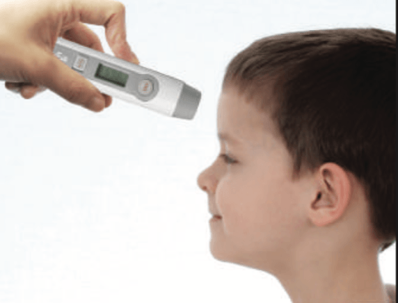 Non Contact Infrared Thermometer in use on a boys forehead
